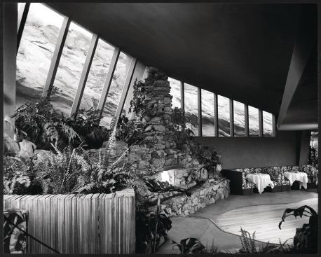 Throughout the club, they emphasized the connection to the surrounding desert with ample use of stone and wood and expanses of glass. Extreme temperatures and falling rock posed problems during construction, but the architects regarded the site as "a continuous testing laboratory for building materials and equipment," they told Southwest Builder and Contractor in the year of the Tennis Club's completion.