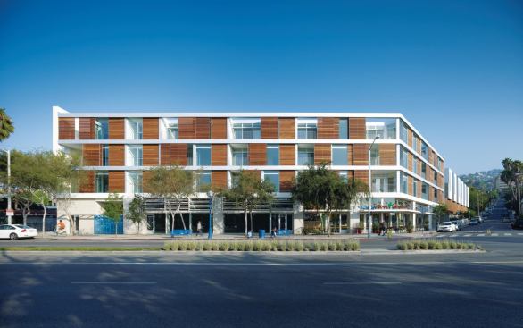Located along Santa Monica Boulevard in West Hollywood, Hancock Lofts conforms to the local planning department's desire to increase urban density. The mixed-income, multiunit housing project incorporates public parking and ground-floor retail. Sliding Mangaris wood shutters can shield residents from the busy thoroughfare.