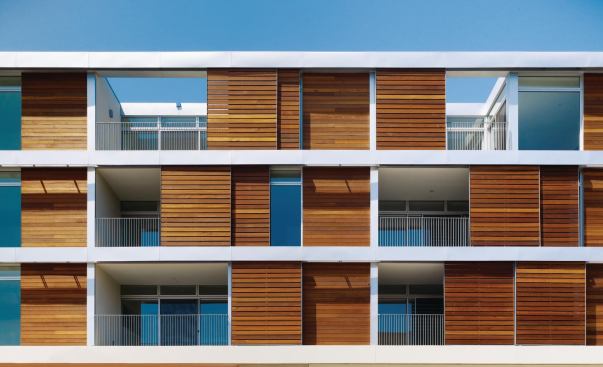 Hancock Lofts façade with Mangaris wood shutters.
