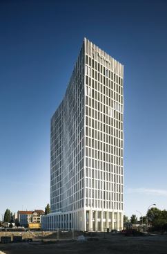 The articulated surface of the concrete skin creates a shadow pattern that offers an ombré effect at different times of day. This is further accentuated by the bent floorplate, which was the result of careful consideration to creating variation in views of Tour Total from the surrounding neighborhoods.