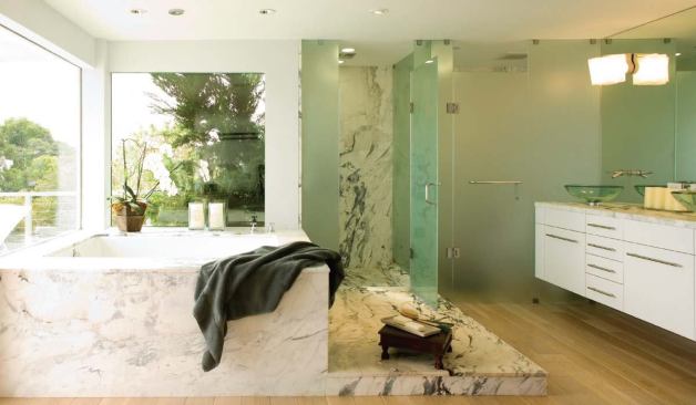 In the bath, window openings mimic tub dimensions, and the ceiling-mounted tub filler aligns with recessed light fixtures. Such symmetry has a soothing effect, says architect Mark English.