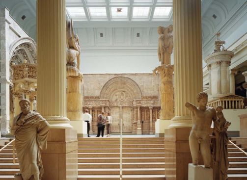 Flanking the entrance to the Hall of Architecture (above left) are Sophocles (at left) and Hermes with the infant Dionysus.
