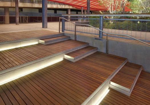 The pavilion stairs are illuminated with thin profile in-grade lensed LED fixtures. 