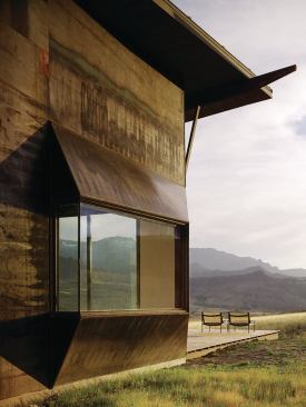 The master bedroom bay's angular, asymmetrical shape directs views toward a picturesque ridgeline called China Wall. Its clear-lacquered steel siding refers to both Western mining camp vernacular and the shifting colors of the landscape.