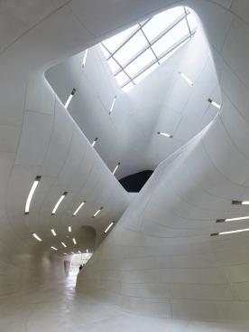 Clad in cast-stone panels, the space is topped by a skylight from Sunshine Rooms.