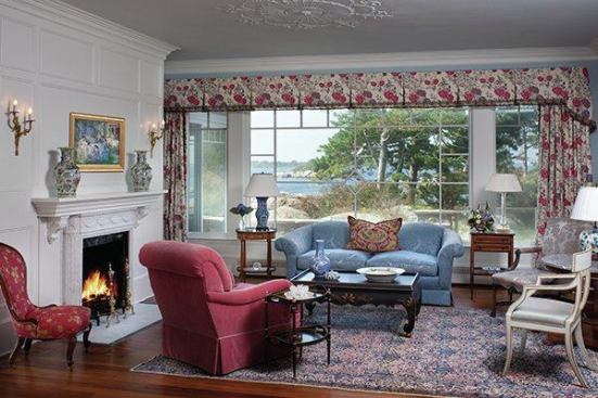 The living room in the 1890s section. The team touched every room at every level of detail: replacing doors and doorknobs; replacing the fireplace surround; touching up the plaster ceiling medallion.