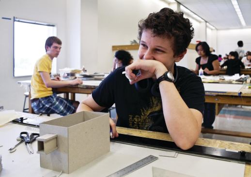 Kiefer Chase takes a break from model-building.