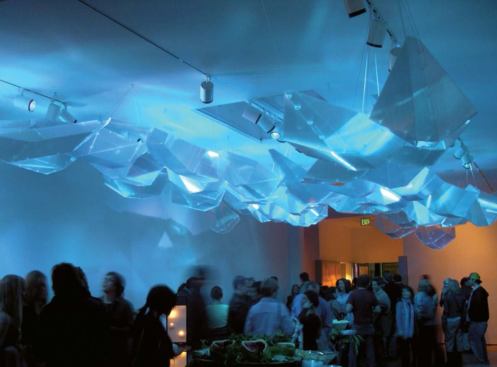 Nubik, Grand Arts Gallery, Kansas City - At opening night festivities, a crowd gathered beneath the installation, which glowed in blue light.