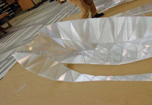 Pleats Please, Issey Miyake, Berlin - To test its accuracy, the full-scale piece was assembled in a Chicago factory before being shipped to Germany. Here, a section of the wall begins to take on its final shape as the zip-ties are threaded and tightened.