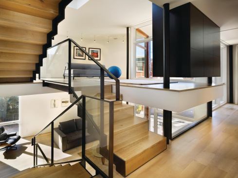 CUSTOM HOME  January-February 2012   Internal Logic  A Philadelphia city house rethinks the suburban split.    Blackened oak storage consoles double as room dividers throughout the house.