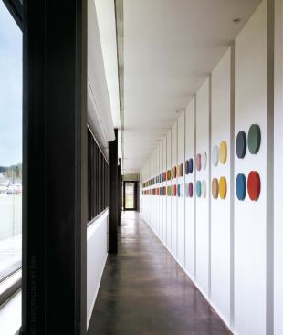 Elliott treated the hallway and the stairwells as a suite of linear and vertical galleries.
