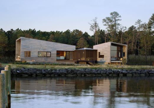 The concrete plinths and minimally pitched shed roofs are typical of local agricultural buildings.