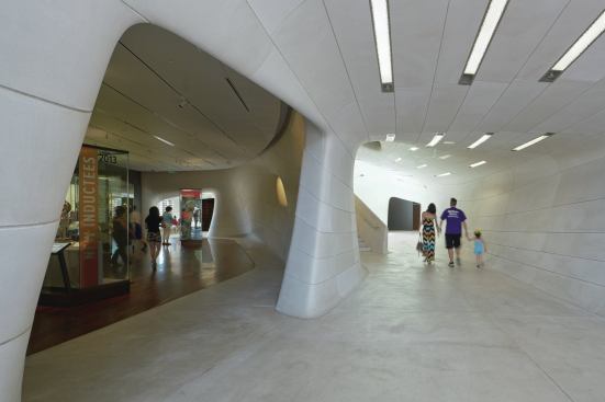 Inside, in the public spaces, cast-stone walls give way to Italian floor tile from Flor Gres. In the first-floor galleries, which hold exhibits related to the Sports Hall of Fame, the tile transitions to warm wood from Allegheny Millwork.