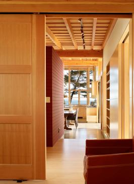 The well-choreographed view from the den through the dining room and kitchen.