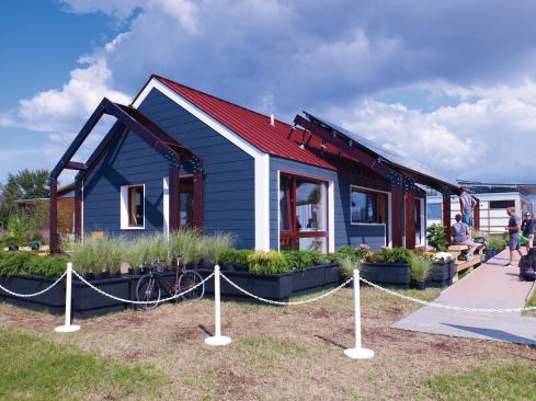 The 4D Home incorporates a divided layout, much like a traditional New England home, and features a gabled roof and exposed beams.