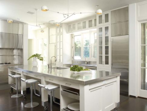 2009 RADA  Riverbank Residence, Stamford, Conn.  Merit Award / Kitchen   Striking contrasts —ebonized floors and white cabinets, a mobile island and fixed appliances, contemporary stainless steel and traditional wood —punctuate the Mianus River Residence’s kitchen.