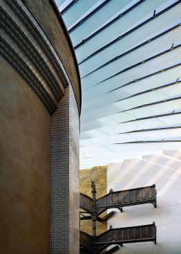 Features used to filter and diffuse daylight in order to protect light-sensitive artifacts include translucent structural onyx screens.