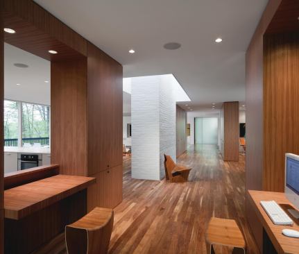 A computer area occupies a niche on axis with the glass entry node.