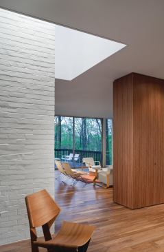 The skylight-encircled chimney stands as an obelisk.