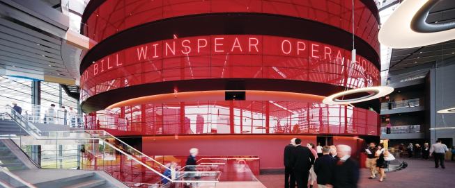 A beaconlike red drum forms the core of the Margot and Bill Winspear Opera House, designed by Foster + Partners.
