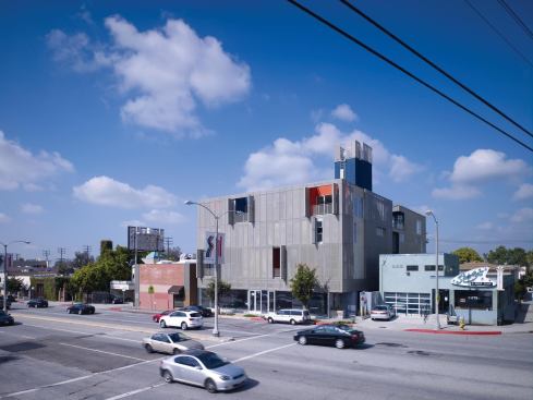 The mixed-use, infill project features retail and parking on the ground floor and an underground parking level.