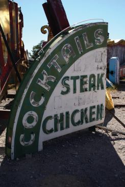 The Green Shack restaurant was originally established as a business catering to Hoover Dam construction workers, and operated continuously from 1930 until 1999. It now resides inside the Neon Boneyard and is the oldest sign currently featured in the Neon Museum’s collection.  