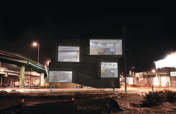 The four large projecting window bays on the south façade correspond to landing areas on the circulation ramps. When a concert is under way, the interior lighting creates a stark contrast against the black rubber siding and puts the spectators on display to drivers on the neighboring highway.