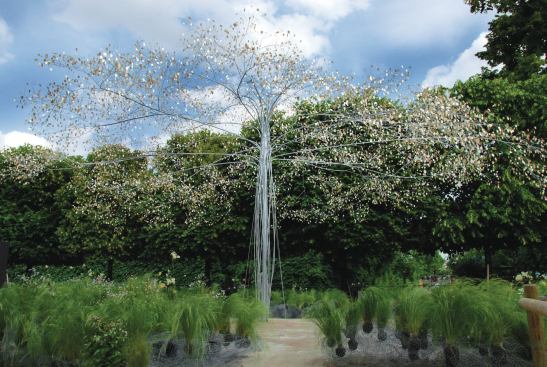 The champagne maker Laurent-Perrier asked Cao | Perrot to create an installation called Aerial Garden for a garden festival in the Tuileries in Paris in 2009. Hoping to represent champagne bubbles visually, the studio fabricated a steel tree with a 35-foot span and a profusion of champagne-colored, mother-of-pearl leaves. Here the wire-mesh clouds are around the base of the piece, anchoring grasses and flowers.