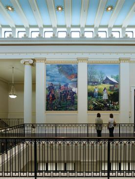The second-floor atrium space is a generous 

33 feet wide and is lined by 16 oil-painted panels by artist Caleb O’Connor, which depict major events in the region’s history.