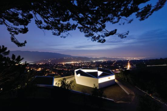 Michael Maltzan Architecture designed this seven-sided house next to a Richard Neutra-designed residence. 
