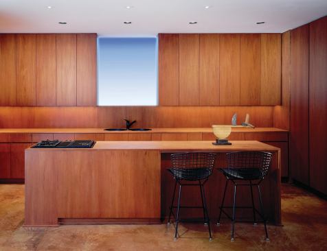 Above the linoleum kitchen counter, colored light can be changed seasonally and on a whim.