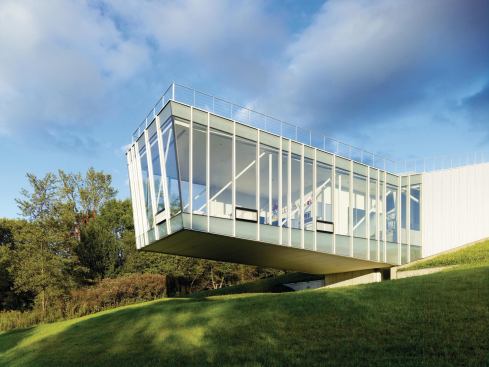 A three-dimensional truss of thin, high-strength steel members supports a cantilever of 45 feet—approximately half of the building's length.