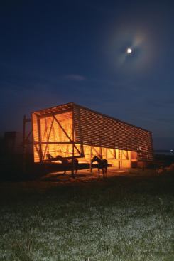 The center includes a barn, cabins, and studio.