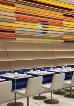 Cascading walls lead down to comfortable banquettes. 






