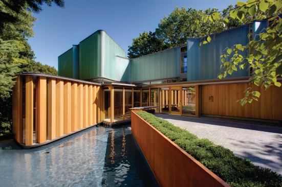 The entrance and reflecting poo of Integral House, designed by Shim-Sutcliffe Architects
