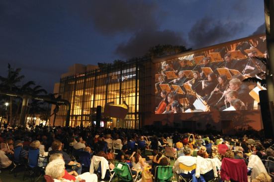 A 7,000-square-foot projection wall in a park adjacent to the building streams musical performance from the auditorium. 