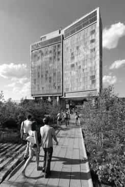 Pedestrians on the High Line approach the building's south façade.