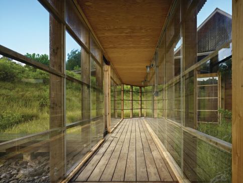 Window-lined walkways link the home's three separate buildings.