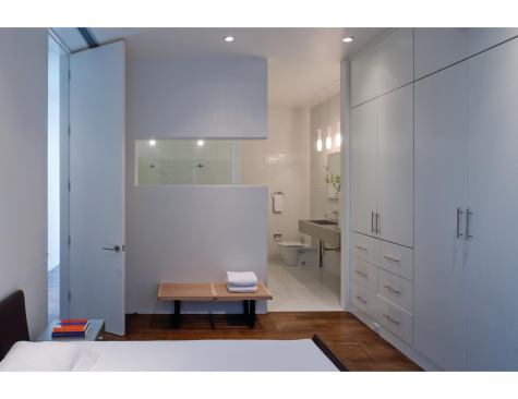 A full-height door opens to the master bedroom and adjoining bath.