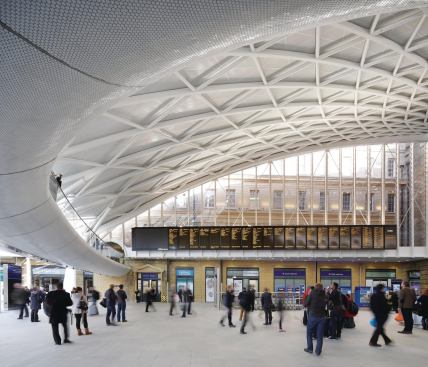 The underside of the mezzanine level in the new Western Concourse at King's Cross station is lined with 5 million white ceramic tiles, coated to repel dirt.