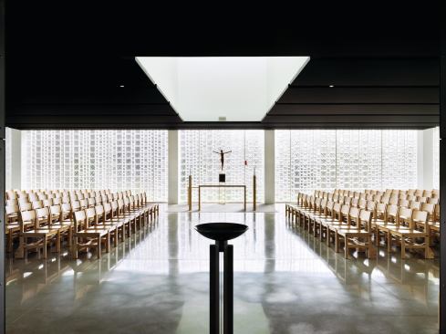 The Chapel of St. Ignatius of Loyola at Christ the King Jesuit College Preparatory School in Chicago is illuminated by the natural light that filters through three walls of varying-sized glass block. 