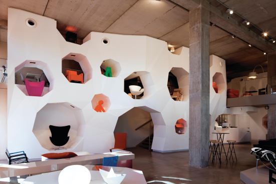 Display wall and staircase leading to mezzanine level.