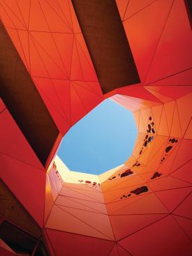 The void that pieces the northwest corner of the building, continues up and through the roof plane. This allows breezes to circuate through the building, helping to produce a cooling effect.