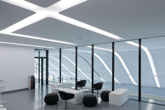 Throughout Pierresvives, carefully curated sightlines and transparency between interior spaces were used to help connect various elements of the program, as in this breakout space overlooking the lobby.