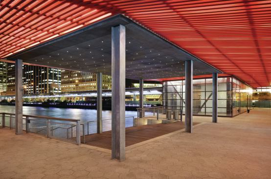 The new pavilion includes a stadium seating area adjacent to the water’s edge and ceiling of LED light points above.  
