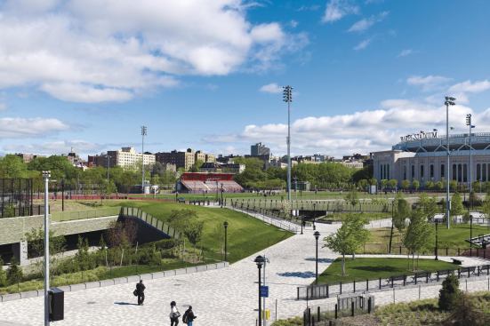 Designed by Clarke Caton Hintz, the Ruppert Plaza Garage in New York blends into the surrounding environment and hosts the Macombs Dam Park on its roof. Pedestrian bridges built over a berm connect the park with the neighboring Heritage Park.