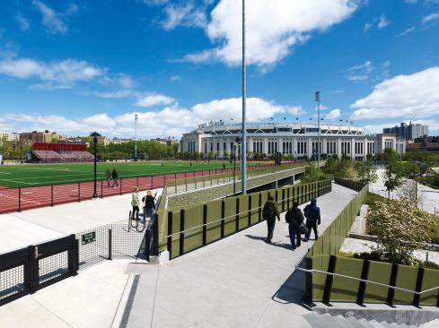 Bridges and ramps help pedestrians navigate the elevation changes between the parks and the stadium.