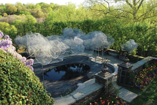 In 2012, Cao and Perrot did a temporary installation called Cloud Terrace at Dumbarton Oaks, the research library and museum in Washington, D.C. On a paved terrace, the designers floated a free-form cloud comprising wire mesh and Swarovski crystals over a reflecting pool set in pebbles. Cloud Terrace, installed in gardens originally designed by Beatrix Farrand, was the third of the studio’s cloud installations; Bow Lake Cloud, planned for a site in Washington state, will use pieces of glass salved from a landfill, stainless steel mesh, and felt.