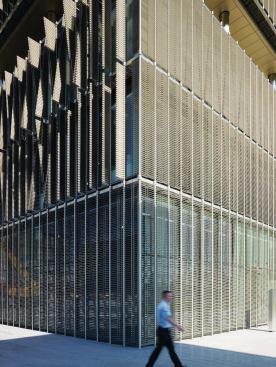 In bright sun, the fins of the sunshading system fold flat against the building to block as much heat as possible. On the shaded side of the building, the fins open to allow in the maximum amount of daylight.