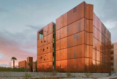Three sides of the new addition are wrapped in copper-alloy panels, which create a breathable rain screen. The southern elevation is purposely kept windowless for the light sensitive research that is conducted in the laboratories behind.